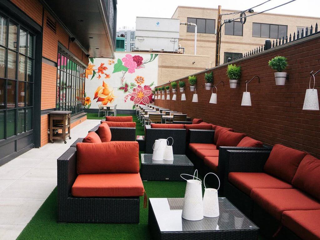 Outdoor dining area with artificial grass from SYNLawn