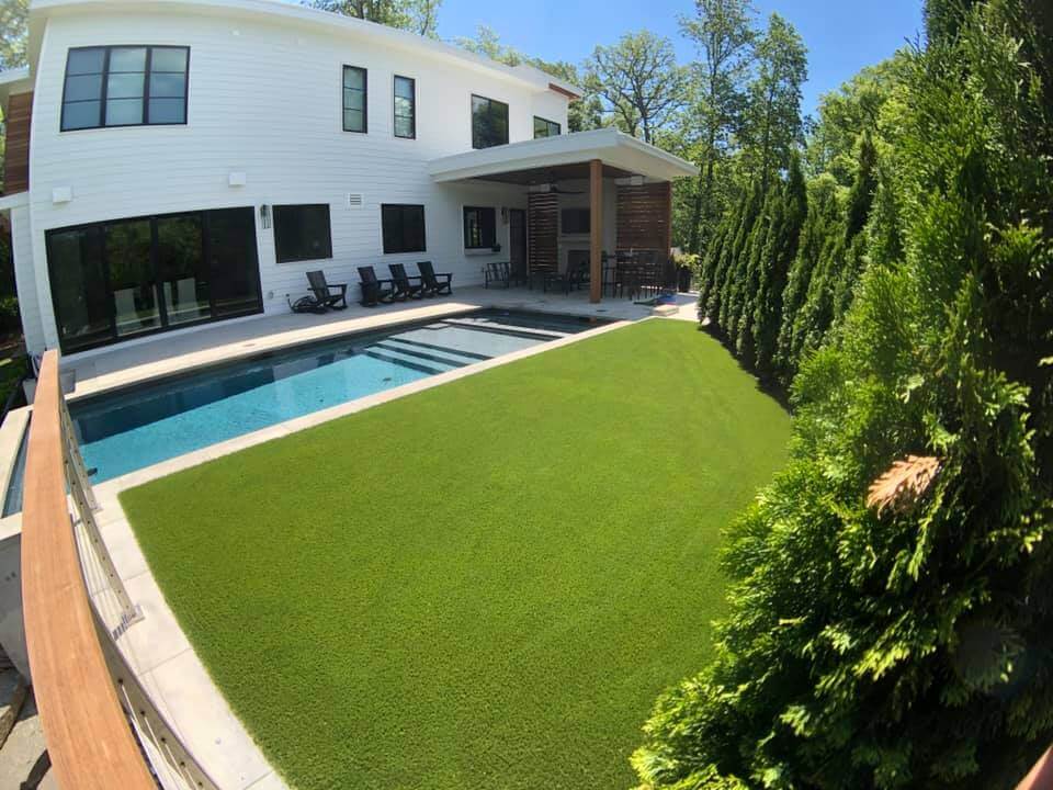Artificial grass backyard pool area from synlawn