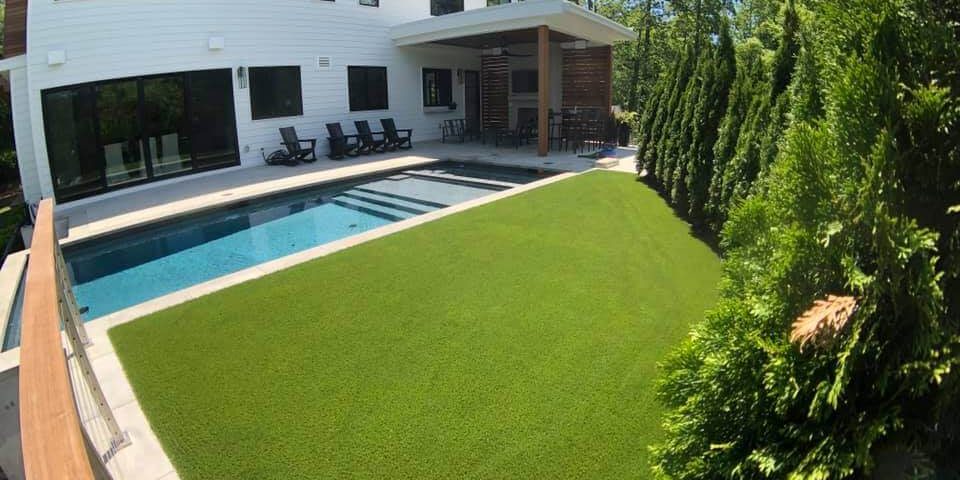 Artificial grass backyard pool area from SYNLawn Chesapeake Bay